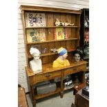 19th century Pine Dresser, the upper section with three shelves above Two Drawers and a Pot Shelf