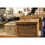 Two mid century Watajoy travelling vanity cases together with two wicker cat baskets.