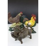 Two Painted Metal Chicken Doorstops together with a Pig with Wings Moneybox