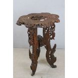 South East Asian Hardwood Side Table, intricately carved with figures, animals and scrolling