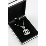 A silver and CZ pendant necklace in the designer style