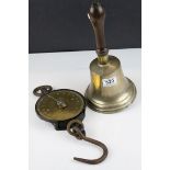 a large brass antique hand bell marked 12 W. H with wooden handle and a 200 lb Salters spring