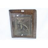 Heavy Oak Plaque with an applied Copper Relief Picture depicting Figures by a Camp Fire, 42cms x