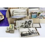 A collection of ephemera to include stamps, postcards and cigarette cards.