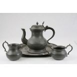 17th century Style Pewter Three Piece Tea Set on Circular Tray, stamped to the underside 5 Crown X