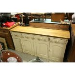 Large painted dresser base of four drawers & four doors