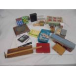 Box of games and puzzles to include draughts, dominoes etc