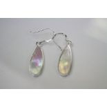 A pair of silver drop earrings set with mother of pearl