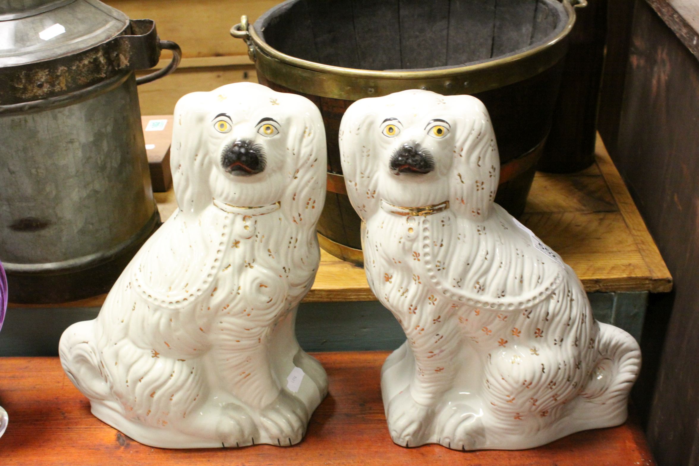 Two large antique Staffordshire dog figures.