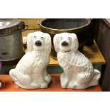 Two large antique Staffordshire dog figures.