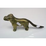 A Vintage novelty brass nutcracker in the form of a dog.