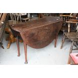George III Mahogany Oval Drop Flap Table on turned legs with pad feet (damage to feet), L.122cms h.