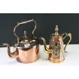 A large antique copper kettle and an eastern copper coffee pot decorated with brass motifs.