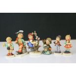 Six Goebel Hummel Figures including Merry Wanderer, Apple Tree Girl, Serenade, Girl with Doll, Boy