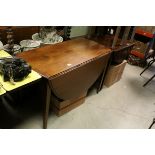 19th century Mahogany Oval Drop Flap Table with drawer to one end, raised on square tapering legs,