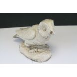 A composite stone Barn Owl sculpture.