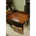 19th century Mahogany Pembroke Table of oval form with drawer to one end and faux drawer to the