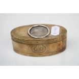 A late 18th century / early 19th century brass snuff box with glass panelled hinged lid.