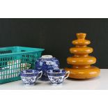 An orange ground retro lamp, blue and white cups and saucers and a lidded ginger jar.