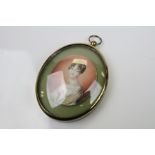An early 19th century miniature portrait of a lady mounted in a later frame.