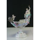 Continental Porcelain Boat Shaped Centrepiece Pedestal Bowl with dragon prow ridden by a cherub