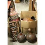 A quantity of treen bowls ,carved gourds wooden masks etc in two boxes