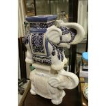 Two Oriental ceramic elephant seats.