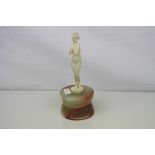 Art Deco ivory nude figurine on a polished onyx base.