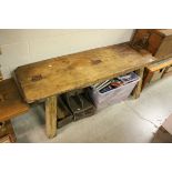 A large antique elm pig bench