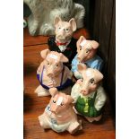 Five Wade Natwest pottery pig money boxes.