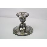 A fully hallmarked sterling silver candlestick with a Birmingham assay mark.