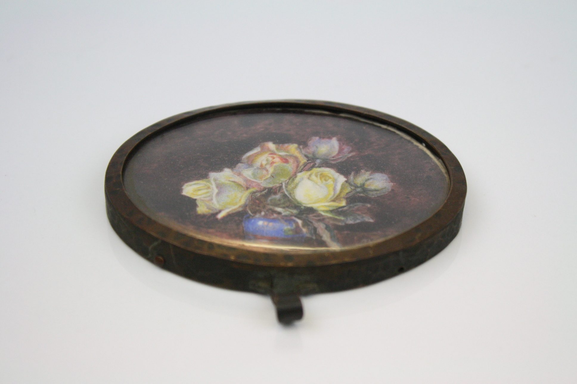 A 19th century oval miniature of a floral display signed Marion Clayton Jones Kent, entitled '