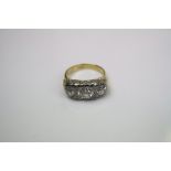 Victorian 18ct gold ring mounted with a 1ct Diamond centre stone accompanied by 2 0.5ct diamonds.