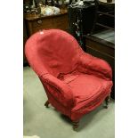 Victorian Upholstered Armchair raised in turned front legs with castors