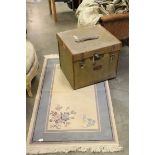 Early 20th century Canvas Trunk, L.56cms h.47cms together with a Cream and Blue Ground Rug, 80cms