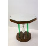 Art Deco Walnut Octagonal Table with Mirrored Glass Top raised on a central stem covered in glass