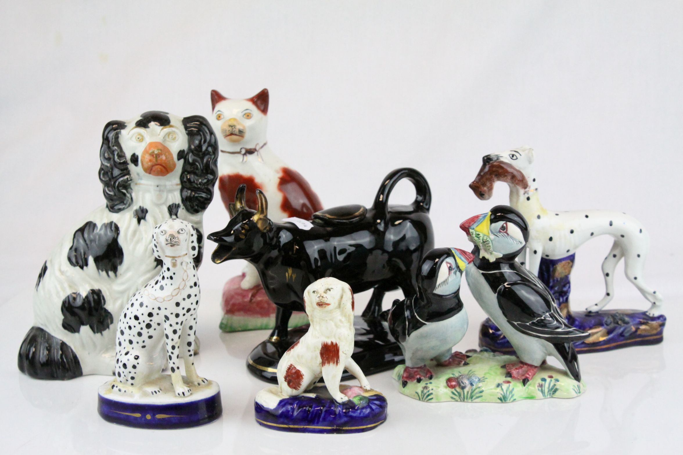 Collection of Ceramics including Four Staffordshire Dogs, Jackfield Black Cow Creamer with Gilt