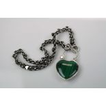 A silver bracelet with heart shaped locket set with malachite