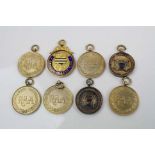 A Collection of 8 x hallmarked 9ct gold sports medals (Weight 70g).