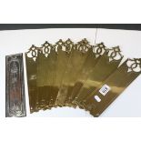 A set of 9 brass Art Nouveau finger door plates and one other.