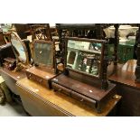 Two Small Early 19th century Mahogany Swing Mirrors, each with platform base with two drawers