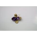 A vintage 14ct gold and amethyst bug brooch.
