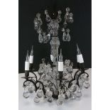 A contemporary candelabra chandelier with glass droplets.