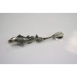 A silver caviar spoon in the form of a sturgeon