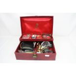 A collection of vintage costume jewellery contained within a vintage jewellery box.