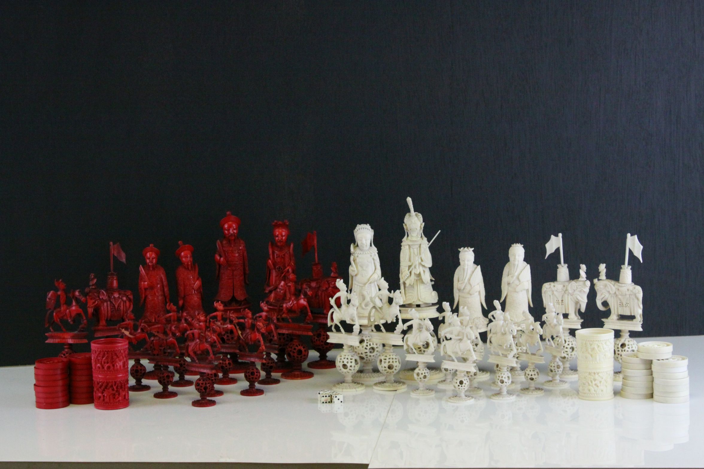 A 19th Century Chinese export carved ivory figural chess set, Canton. The white and red side