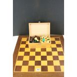 A boxed late 20th century Staunton chess set with board, paper label to inside of box.