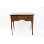 George III Oak Side Table with an arrangement of Three Drawers, Shaped Apron and raised on Square