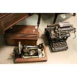 An early 20th century Remington Standard typewriter and a similar cased Singer sewing machine