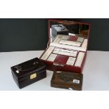 A red leather jewellery box with key, one other and a carved hardwood box.